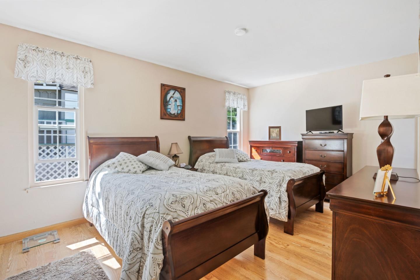 1128 Oddstad Boulevard Pacifica, CA 94044 - Photo 10 of 35 a bedroom with two beds and a couch