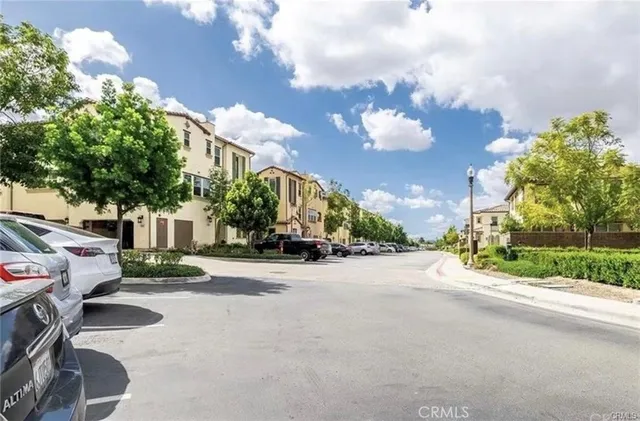 a view of a street with a building in the background