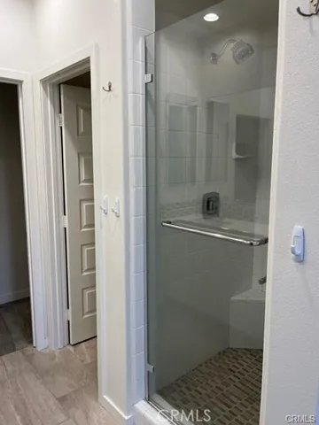 a bathroom with a shower and a toilet