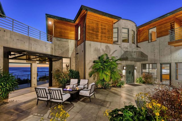 a backyard of a house with garden and patio
