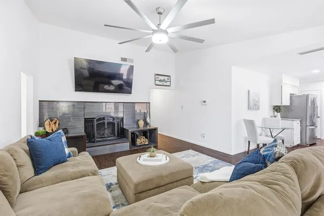 a living room with furniture and a fireplace