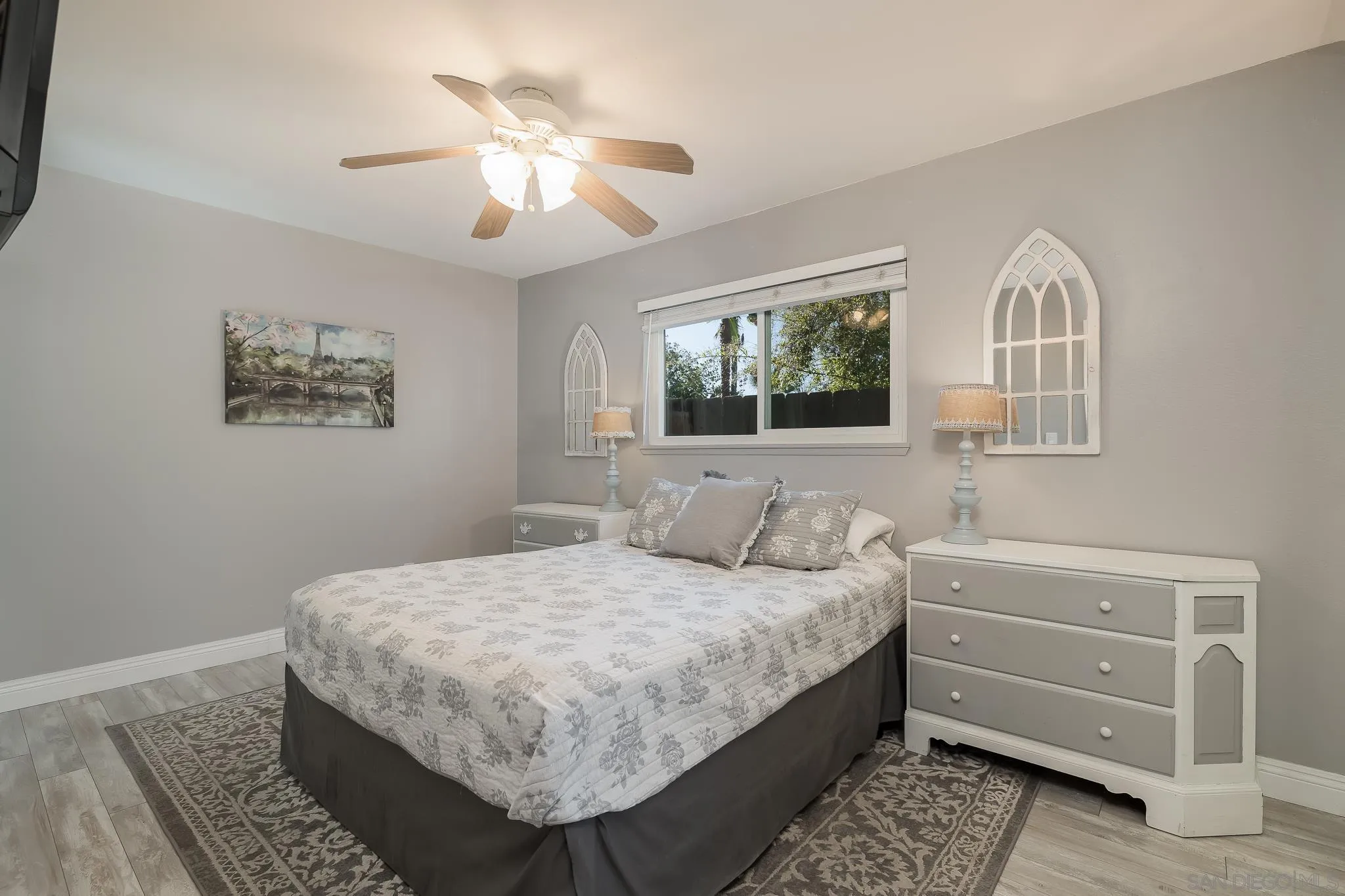 9126 Heatherdale Street Santee, CA 92071 - Photo 12 of 33 a bedroom with a bed and a chandelier