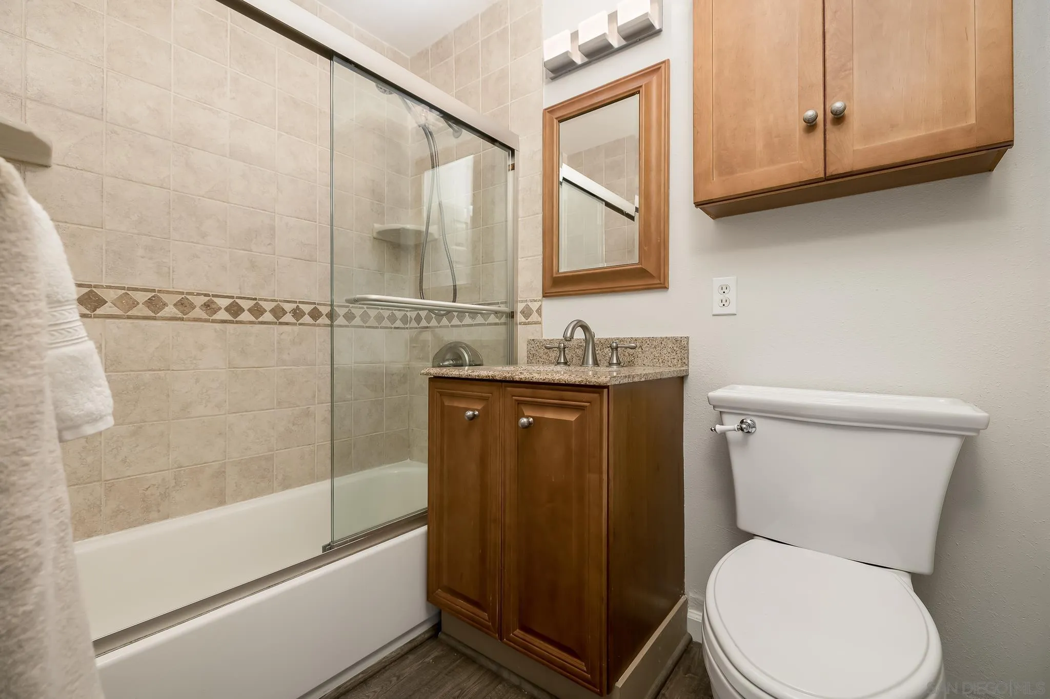 9126 Heatherdale Street Santee, CA 92071 - Photo 17 of 33 a bathroom with a toilet a sink and bathtub