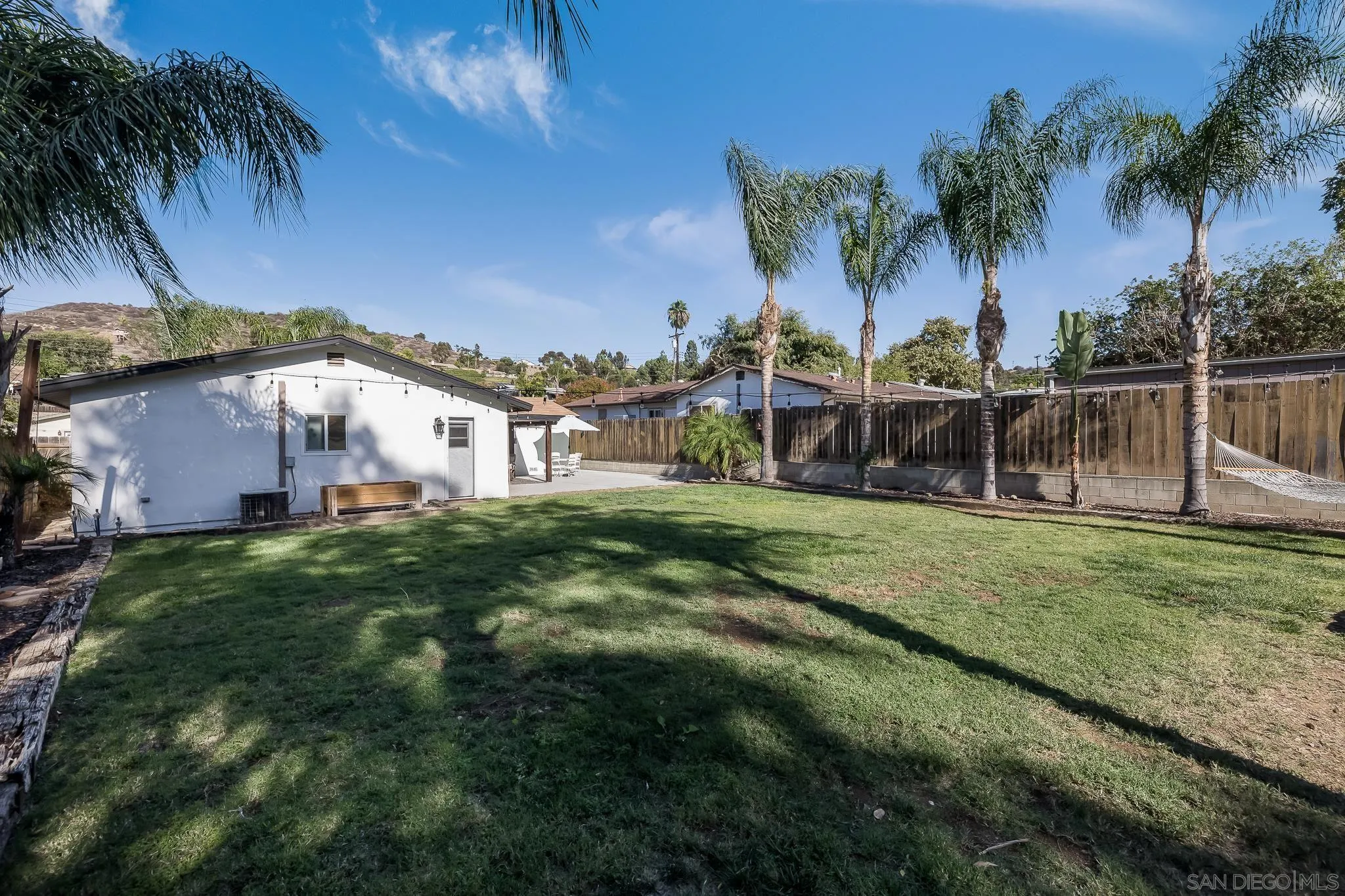 9126 Heatherdale Street Santee, CA 92071 - Photo 24 of 33 a view of a house with a yard and sitting area