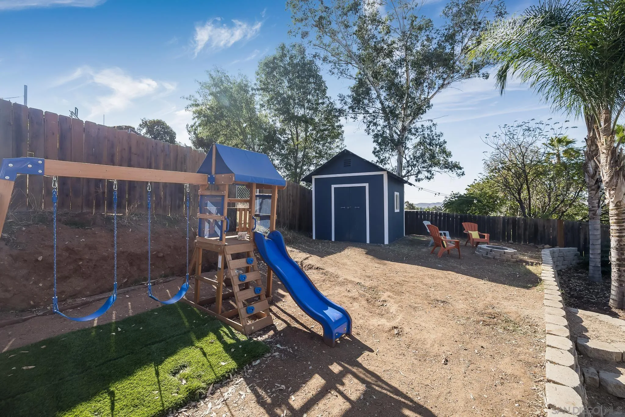 9126 Heatherdale Street Santee, CA 92071 - Photo 26 of 33 a house with trees in front of it
