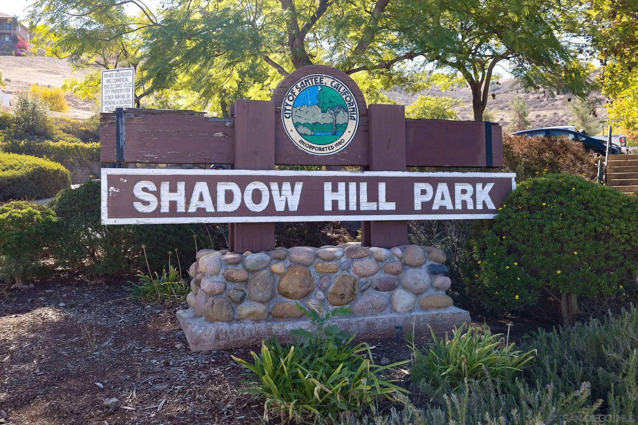 9126 Heatherdale Street Santee, CA 92071 - Photo 29 of 33 a sign that is sitting on a brick wall