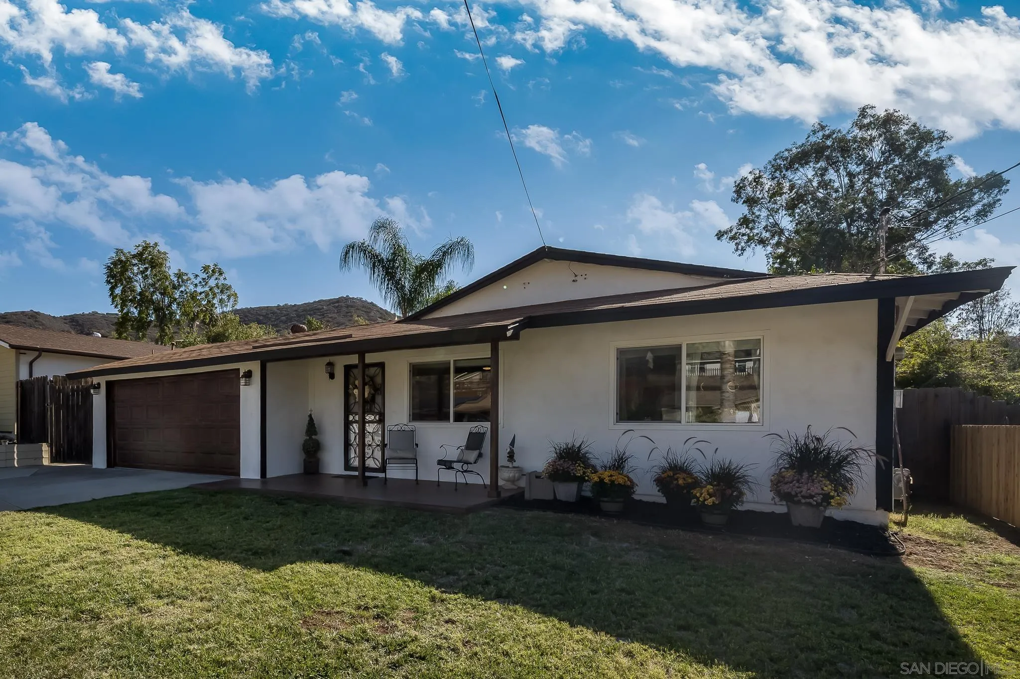 9126 Heatherdale Street Santee, CA 92071 - Photo 3 of 33 a front view of house with yard and green space