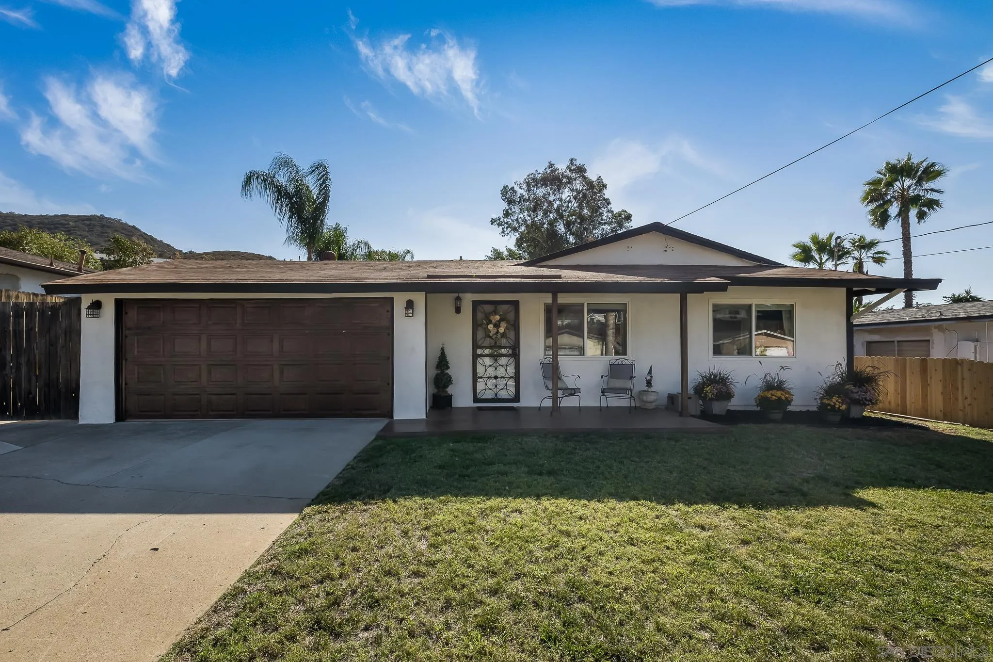 9126 Heatherdale Street Santee, CA 92071 - Photo 4 of 33 front view of a house with a garden