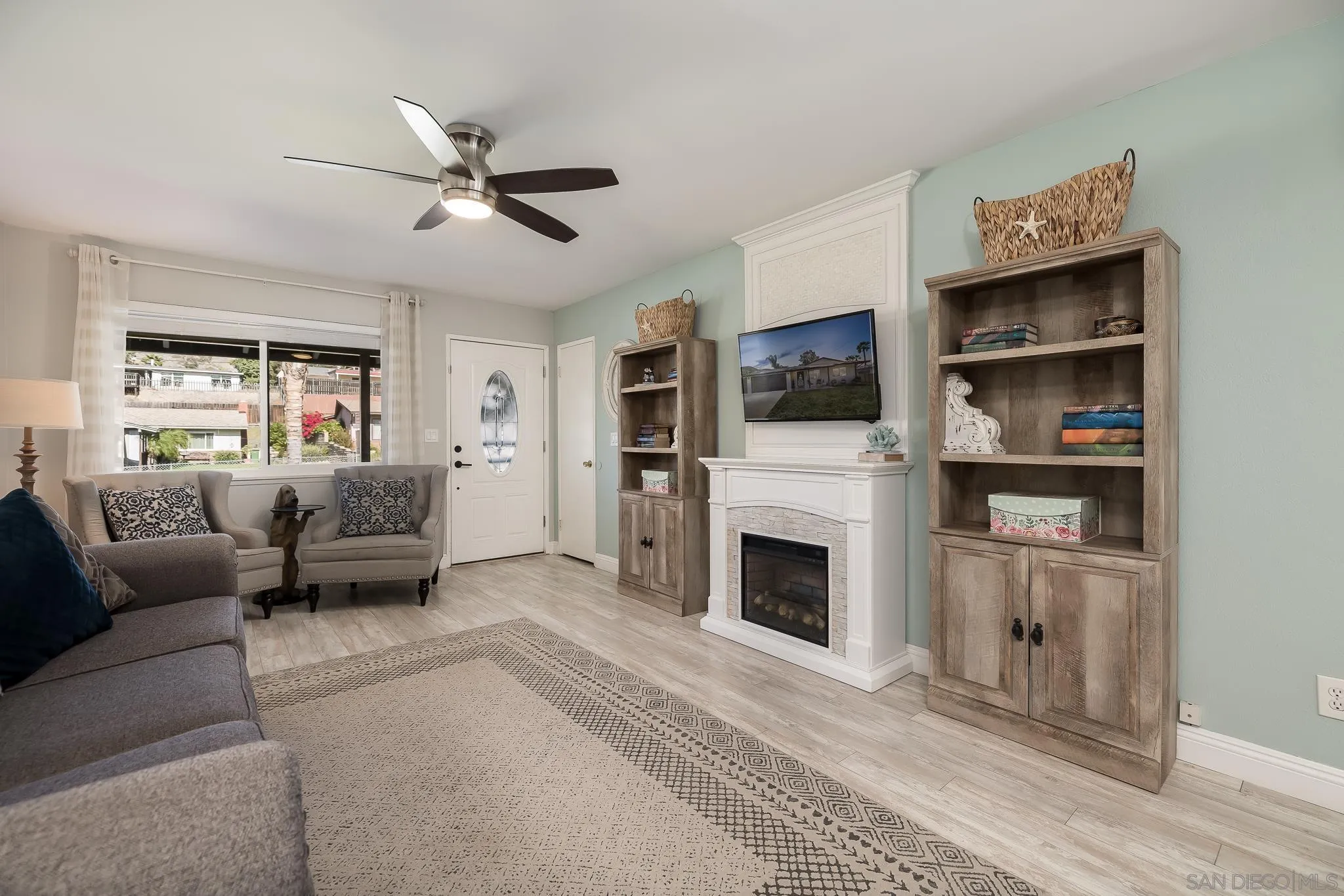 9126 Heatherdale Street Santee, CA 92071 - Photo 7 of 33 a living room with furniture and a fireplace
