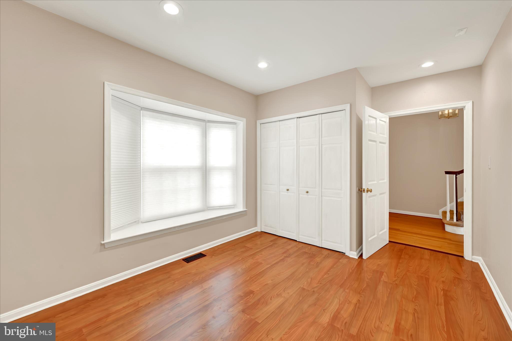2317 Wonderview Road Lutherville-Timonium, MD 21093 - Photo 5 of 27 an empty room with wooden floor and a window