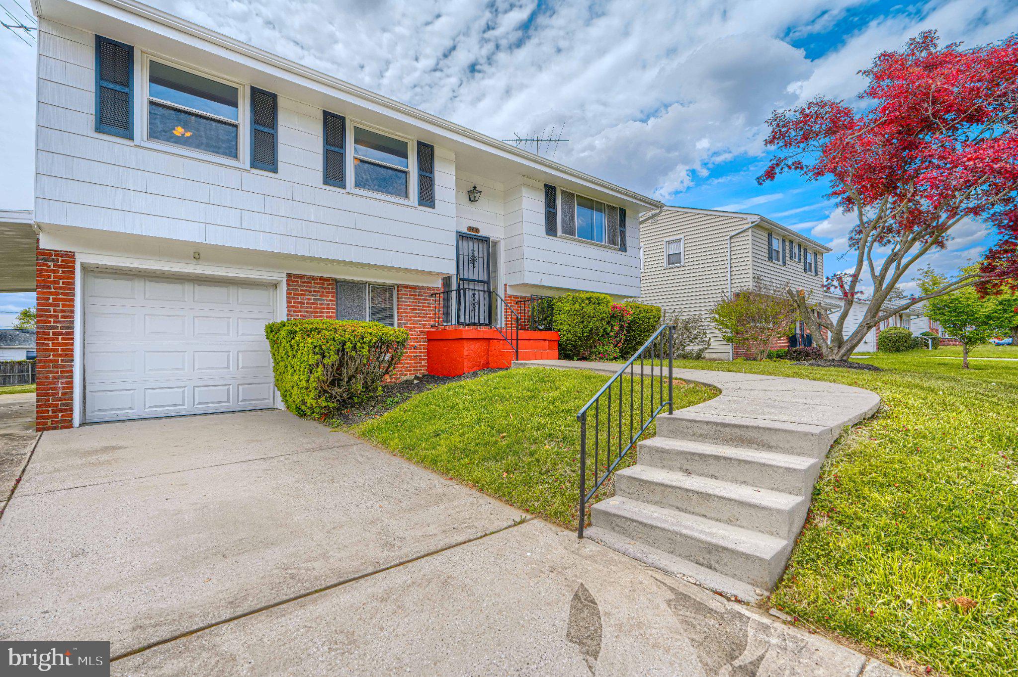 Charming home with vibrant curb appeal.