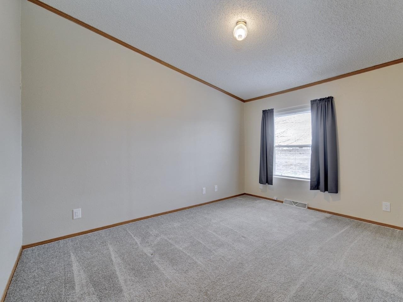 2206 I Road Grand Junction, CO 81505 - Photo 16 of 28 an empty room with windows
