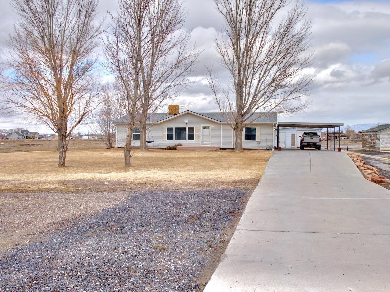 2206 I Road Grand Junction, CO 81505 - Photo 2 of 28 a view of residential houses with yard and trees