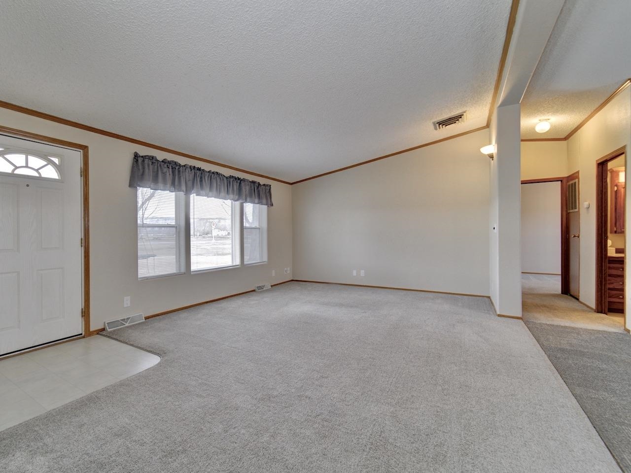 2206 I Road Grand Junction, CO 81505 - Photo 3 of 28 an empty room with windows and closet