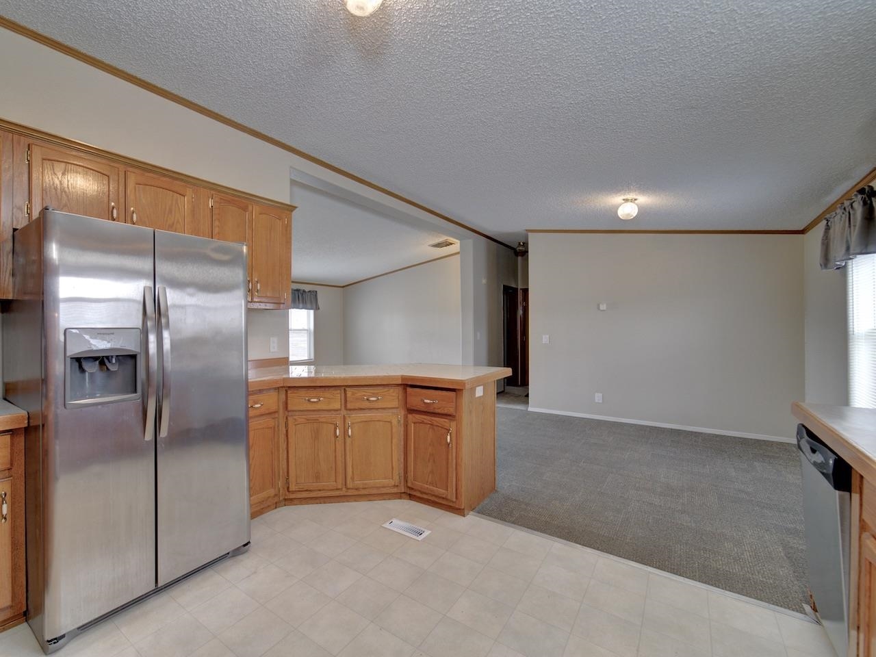 2206 I Road Grand Junction, CO 81505 - Photo 8 of 28 a kitchen with stainless steel appliances granite countertop a refrigerator a sink and dishwasher