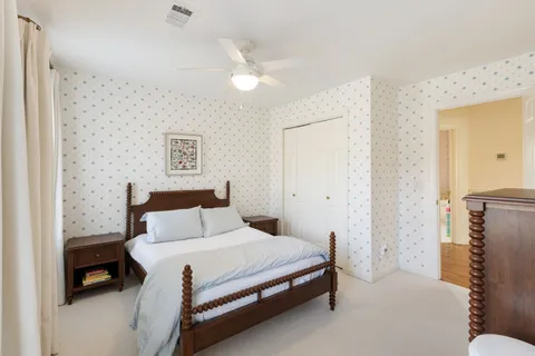 a bedroom with a bed and a table