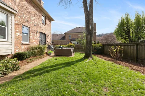a view of backyard with patio
