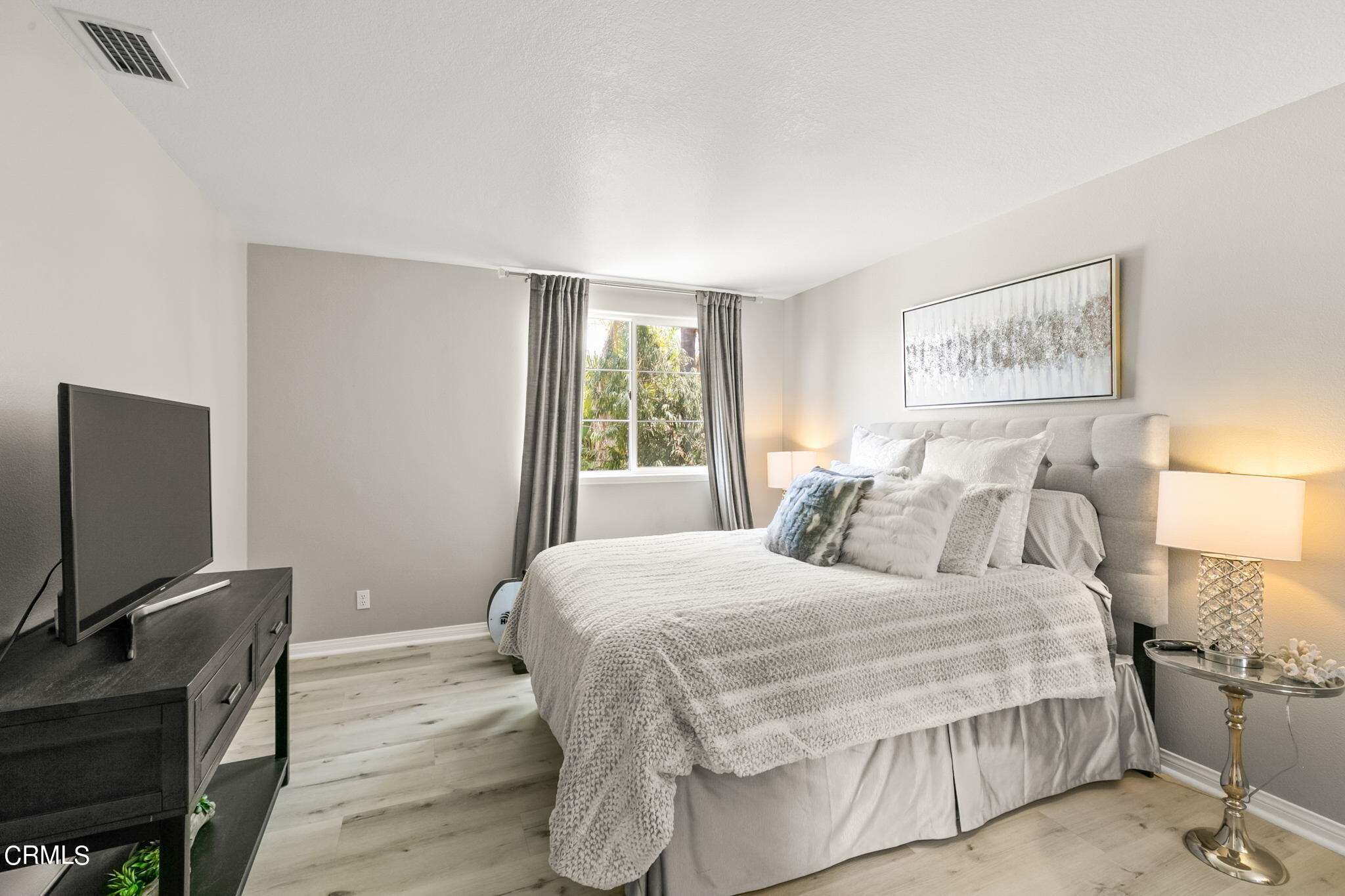1132 Corte Riviera Camarillo, CA 93010 - Photo 13 of 20 a bedroom with a bed and a flat screen tv