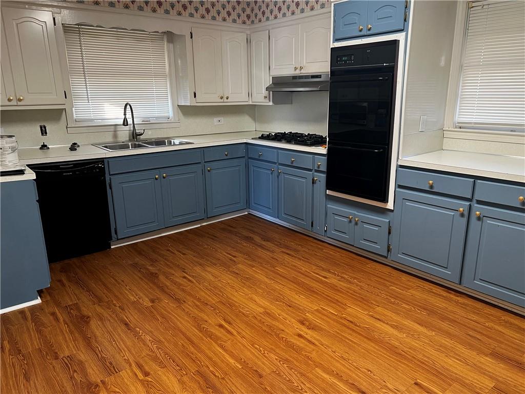 606 Pisgah Way Calhoun, GA 30701 - Photo 10 of 18 a kitchen with stainless steel appliances granite countertop a sink stove and cabinets