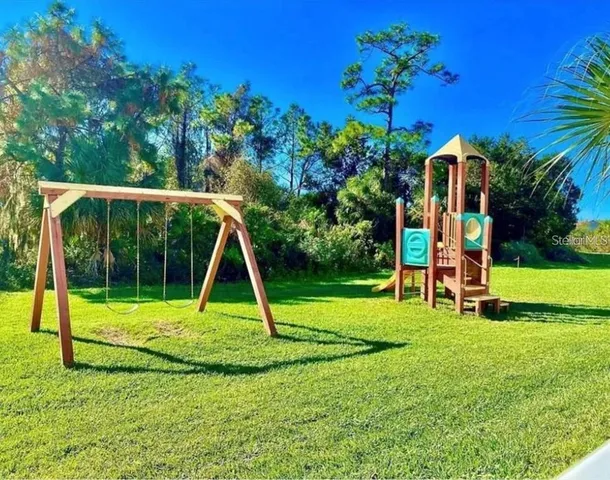 a view of a park with a slide