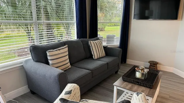 a living room with furniture and a window