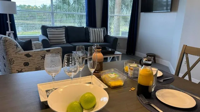 a view of a dining room with furniture and a window