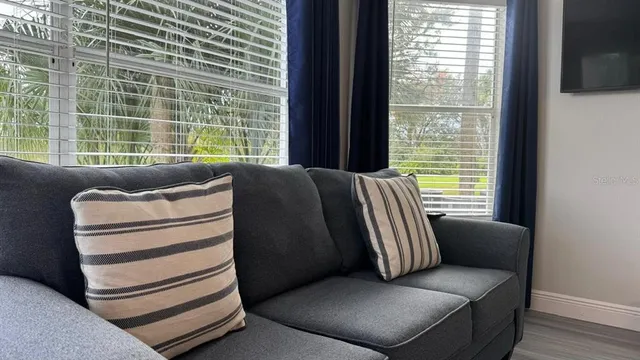 a living room with furniture and a window
