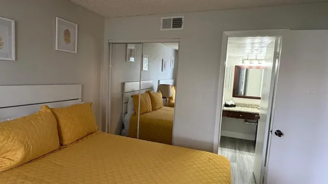 a bedroom with bed and window