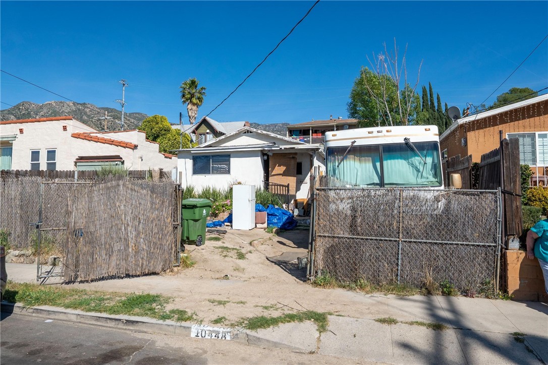 10448 Mountair Avenue Tujunga, CA 91042 - Photo 1 of 1 a view of a white house with a small yard and plants