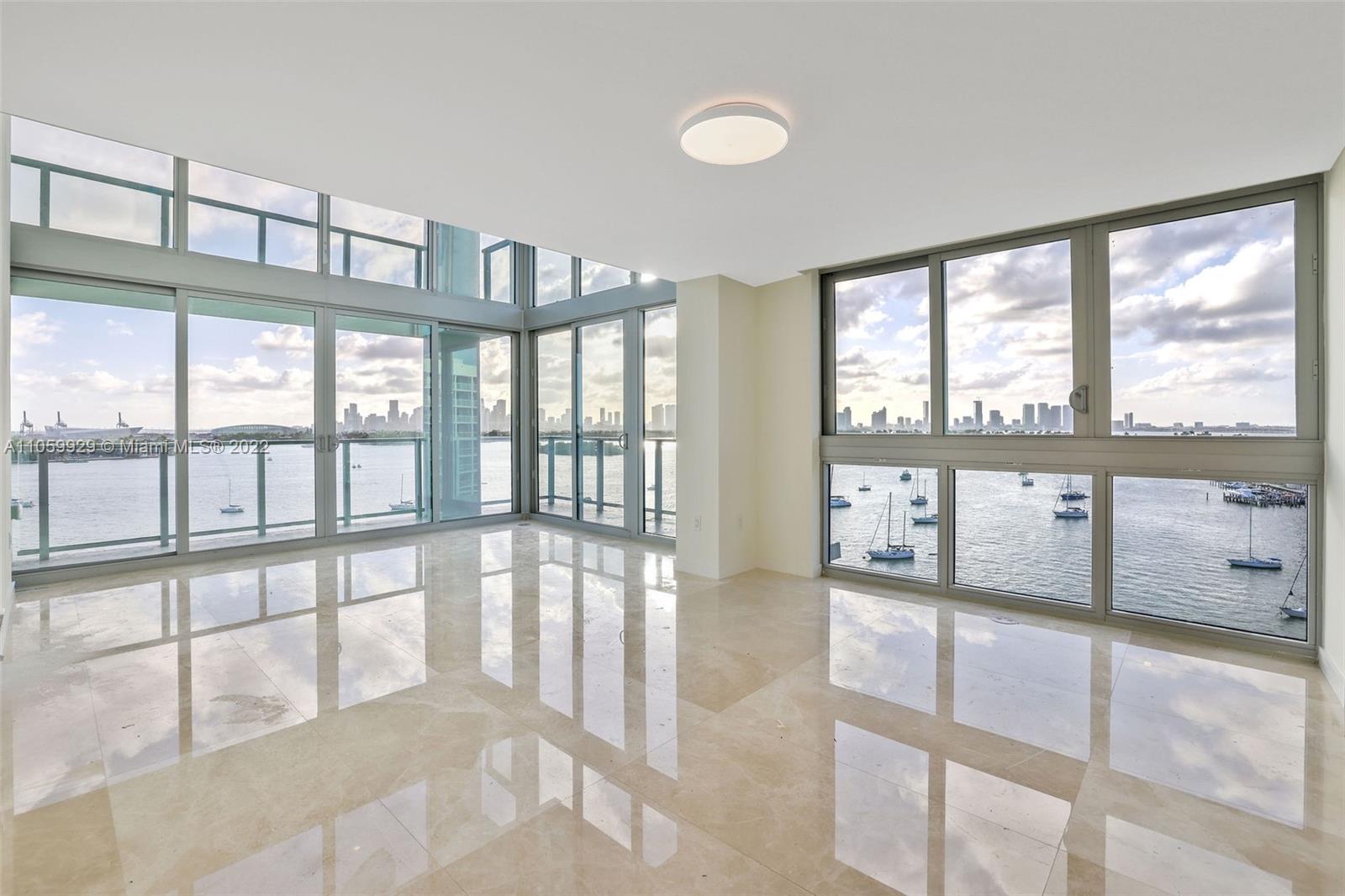 a view of an empty room with a large window