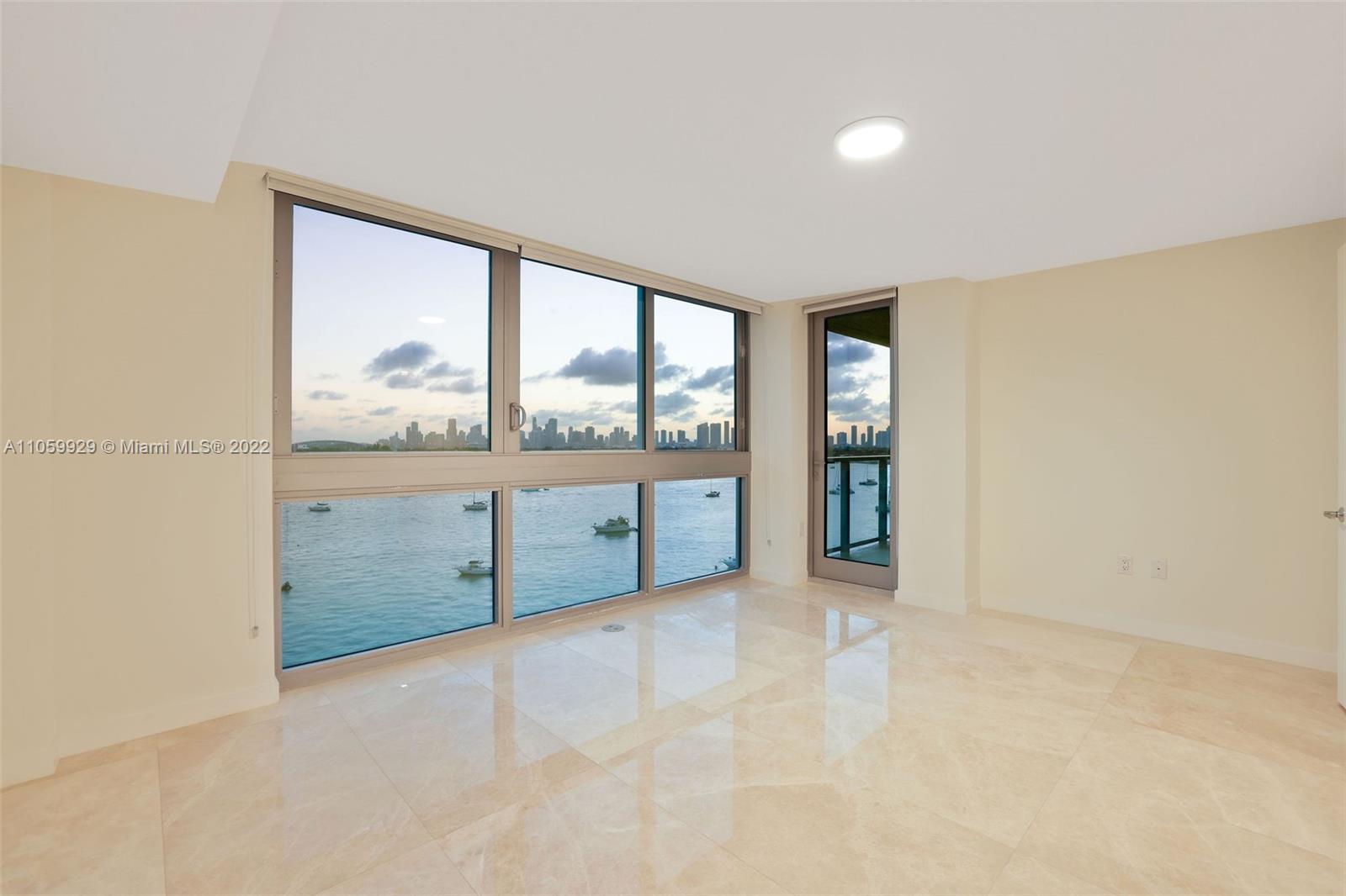 1504 Bay Road, Unit N0915 Miami Beach, FL 33139 - Photo 24 of 94 wooden floor in an empty room with a window
