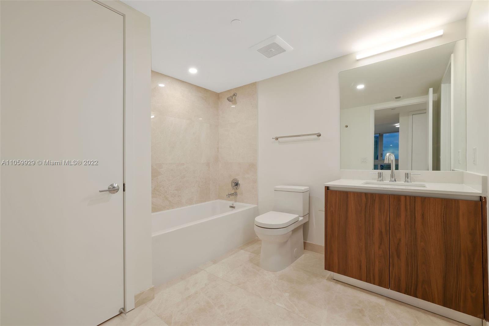 1504 Bay Road, Unit N0915 Miami Beach, FL 33139 - Photo 29 of 94 a bathroom with a sink a toilet and shower