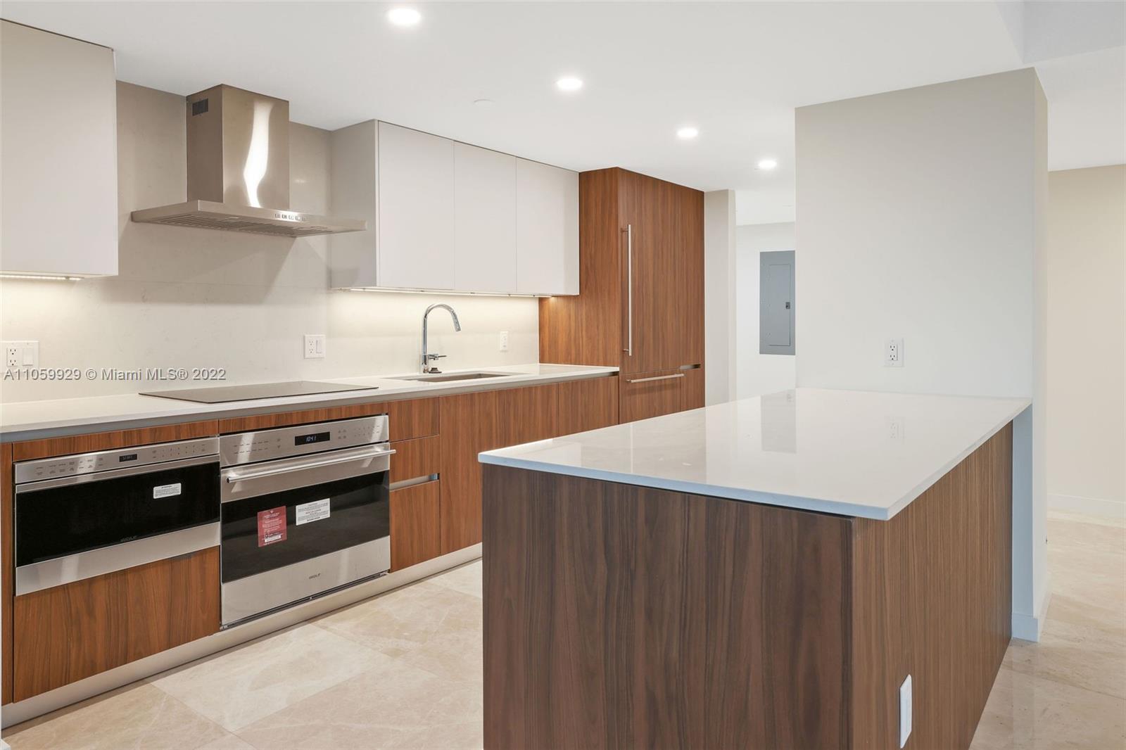 1504 Bay Road, Unit N0915 Miami Beach, FL 33139 - Photo 6 of 94 a kitchen with stainless steel appliances a sink a stove a refrigerator and cabinets
