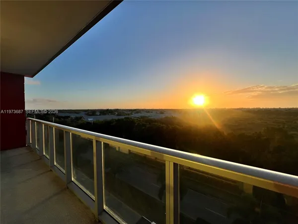 a view of balcony with furniture