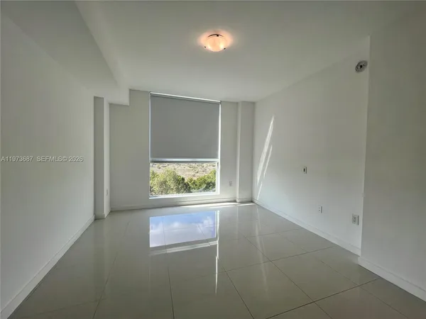 a view of city and mountain from a balcony