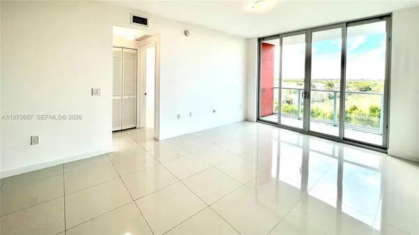 a view of an empty room with a window