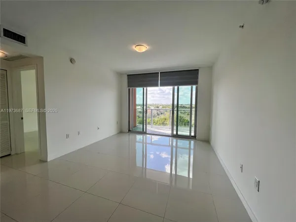 a view of an empty room and window