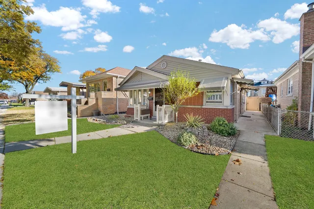 a view of a house with backyard porch and sitting area