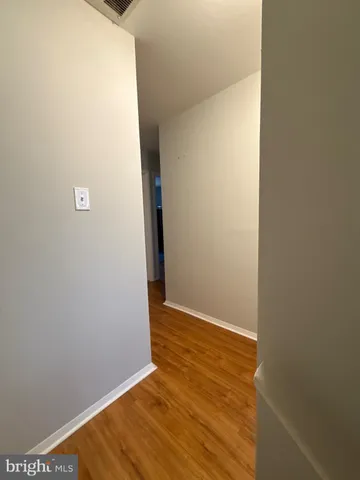 a view of a small space with wooden floor