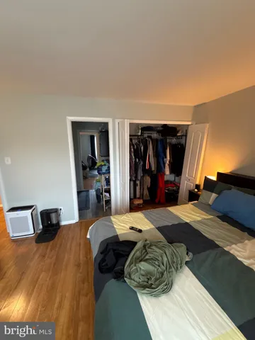 a bed room with a bed and a tv