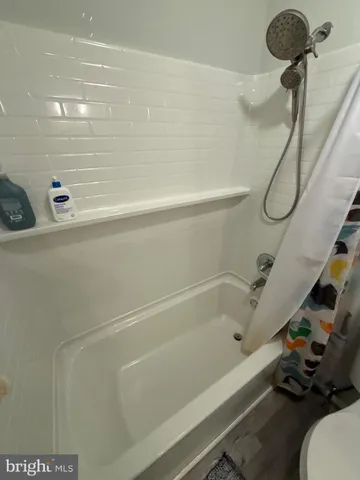 a bathroom with a bath tub