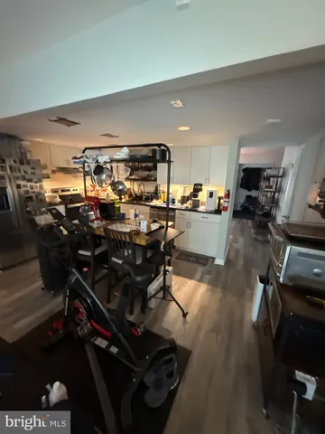 a living room with furniture and a book shelf