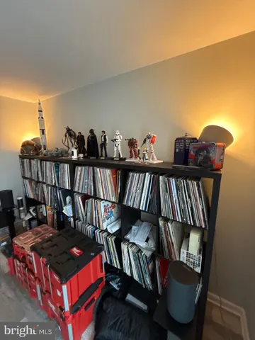a view of closet with wooden floor