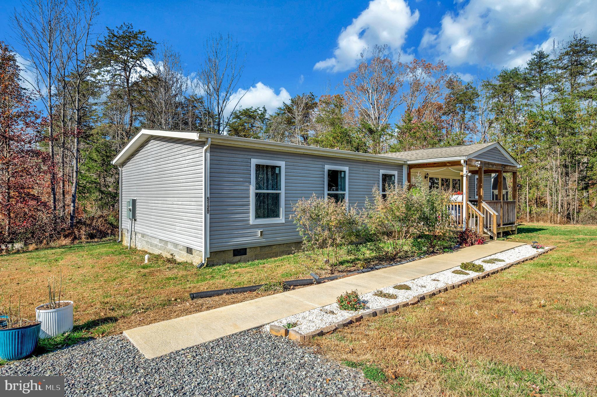 5120 Burr Hill Road Rhoadesville, VA 22542 - Photo 1 of 45 a view of a house with a yard