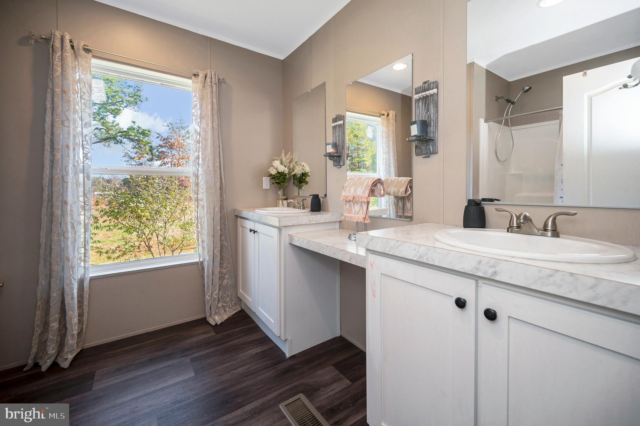5120 Burr Hill Road Rhoadesville, VA 22542 - Photo 28 of 45 a bathroom with a granite countertop sink and a window