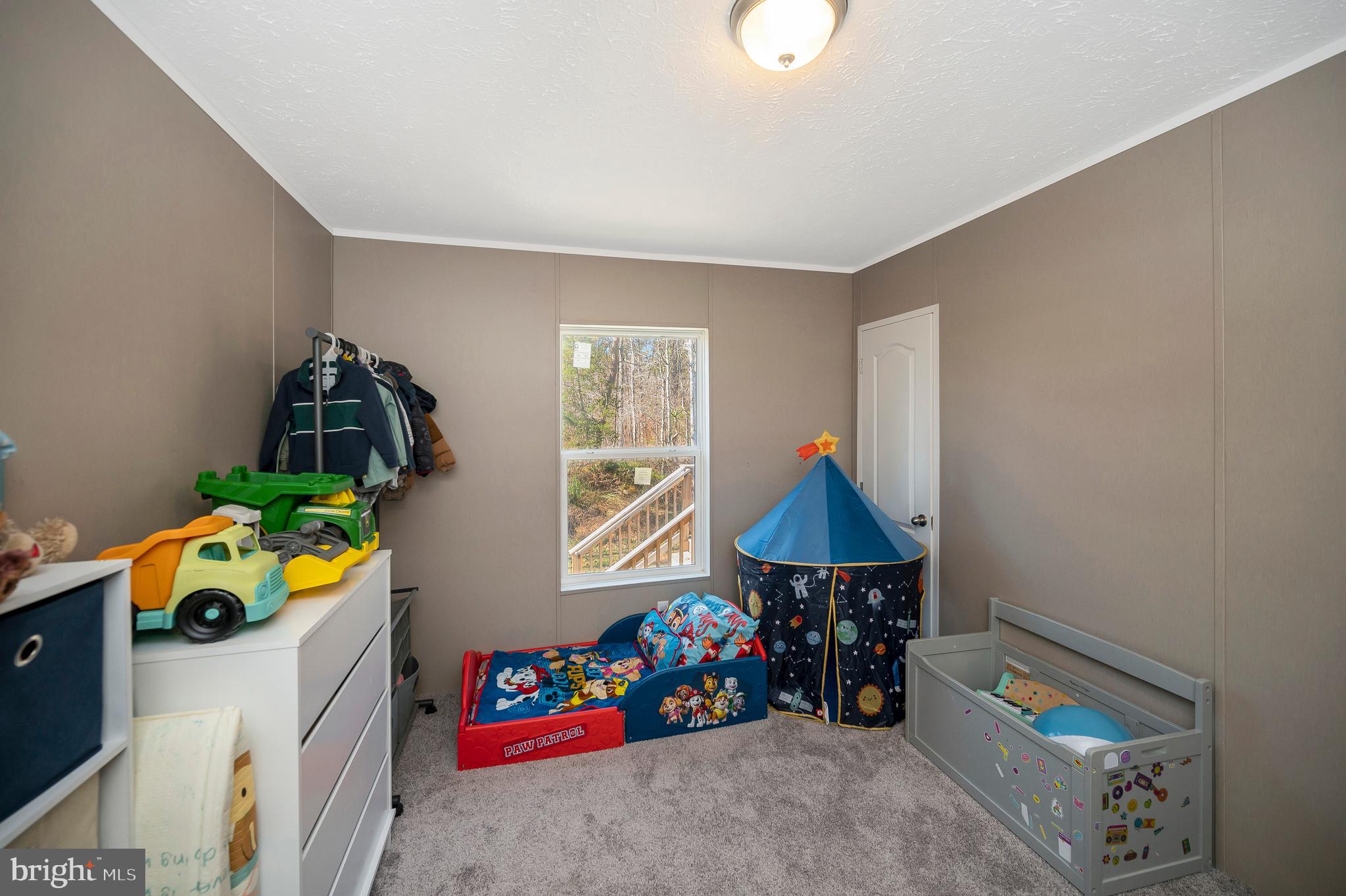 5120 Burr Hill Road Rhoadesville, VA 22542 - Photo 32 of 45 a children room with toys and a window