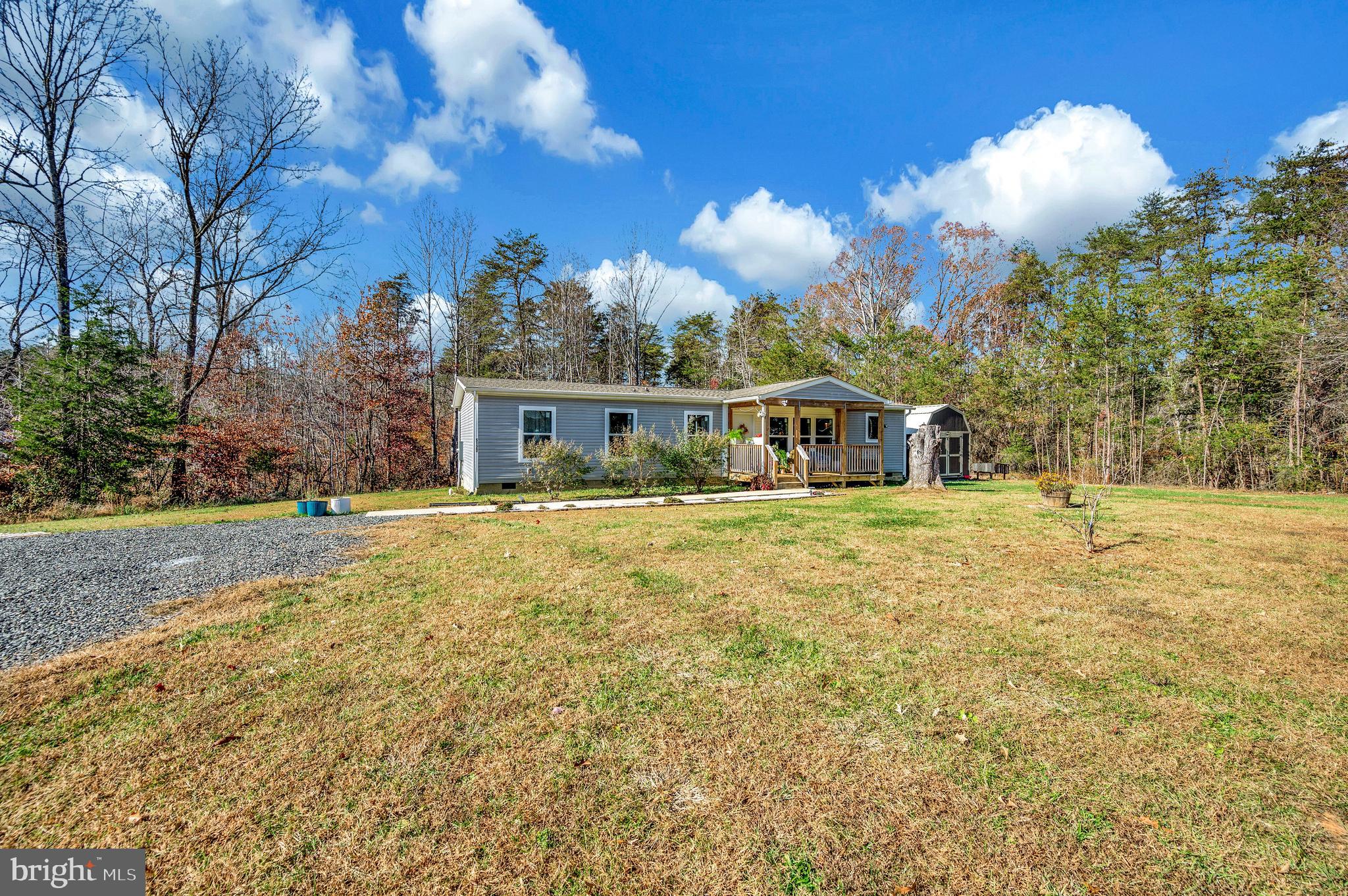 5120 Burr Hill Road Rhoadesville, VA 22542 - Photo 35 of 45 a front view of a house with a yard