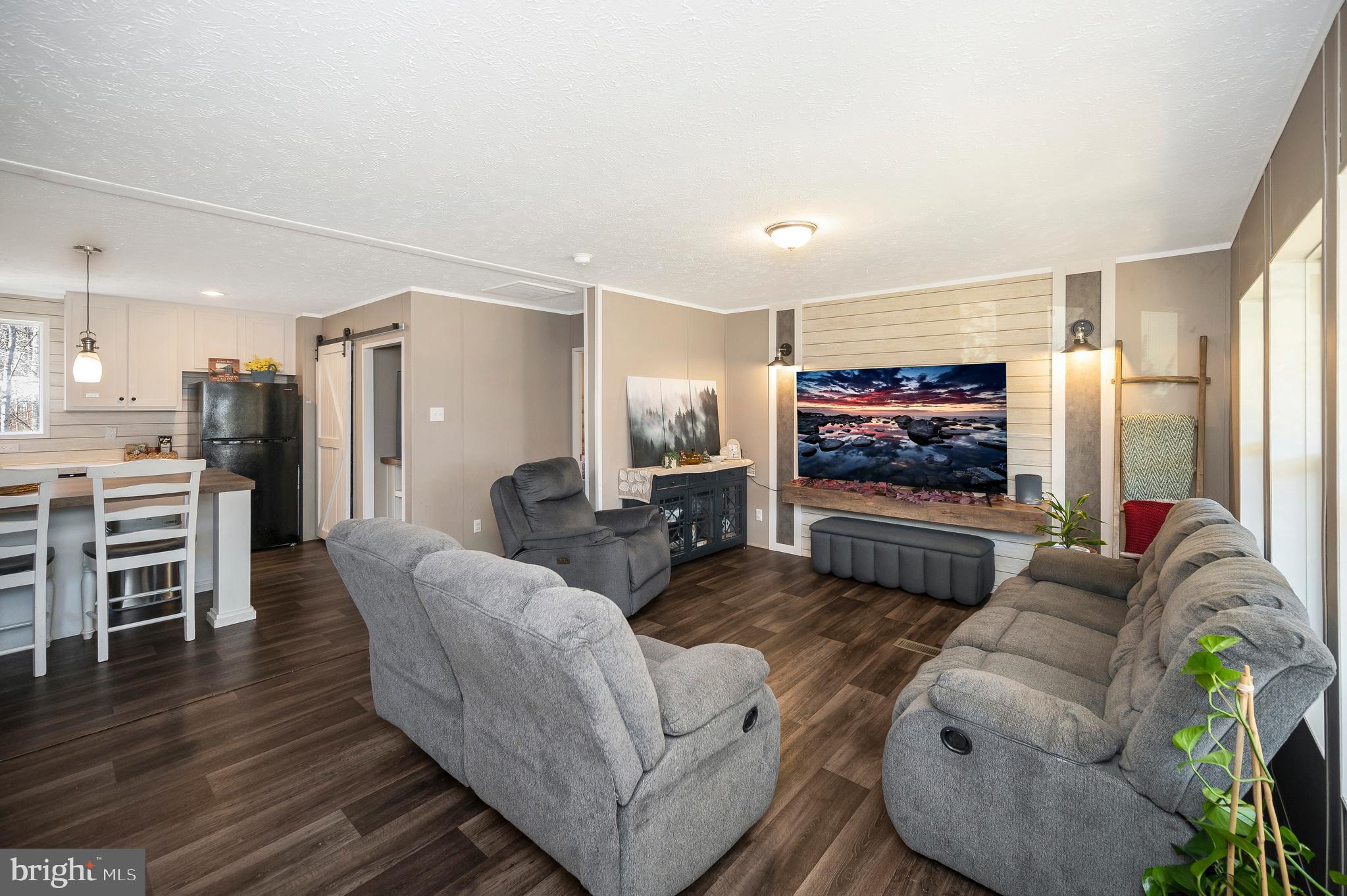 5120 Burr Hill Road Rhoadesville, VA 22542 - Photo 4 of 45 a living room with furniture and a flat screen tv