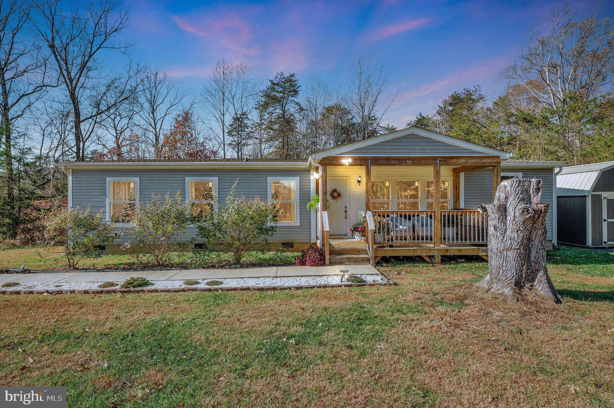 5120 Burr Hill Road Rhoadesville, VA 22542 - Photo 45 of 45 a view of a house with backyard porch and sitting area