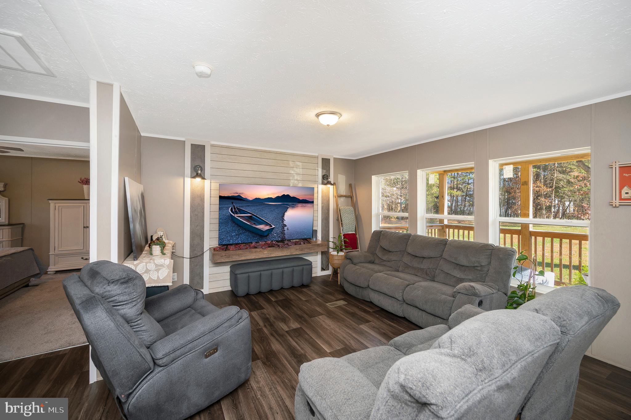 5120 Burr Hill Road Rhoadesville, VA 22542 - Photo 5 of 45 a living room with furniture and a flat screen tv